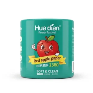 A tissue paper featuring the Apple logo, placed next to a can of apple juice on a table.